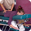spinal manipulation of patient by chiropractor on bench